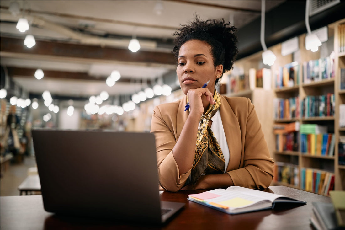 woman at laptop computer in library